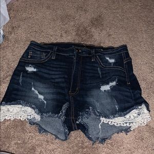 Kancan Jean shorts with lace trim.